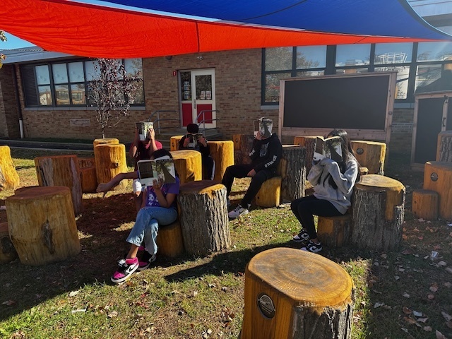 kids Reading at the outdoor classroom