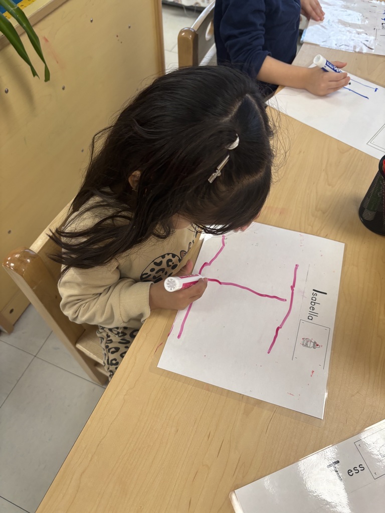 Learning to write our name is Pre-K!