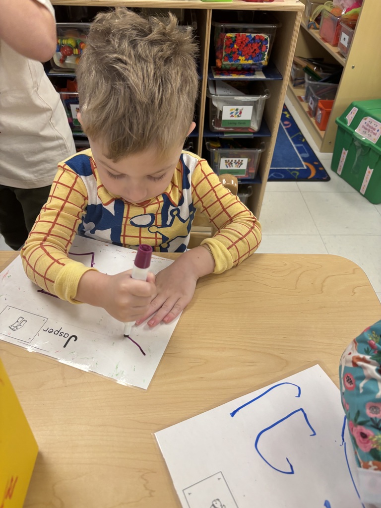 Learning to write our name is Pre-K!