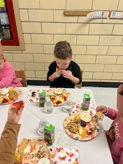 Pre K student enjoying the treats!