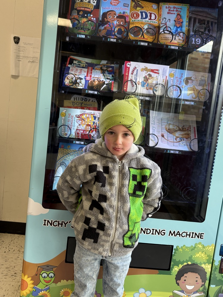 Dylan was caught being kind too some friends in his class!He was able to pick a book from the vending machine!