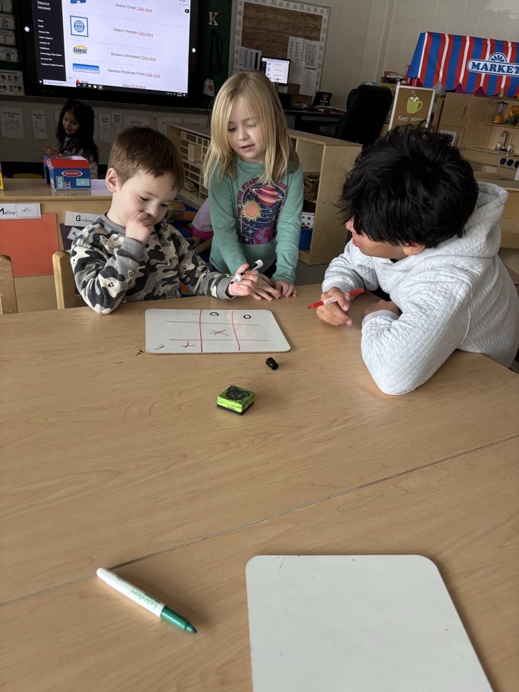 A friendly game of Tic Tack Toe with our student helper! 