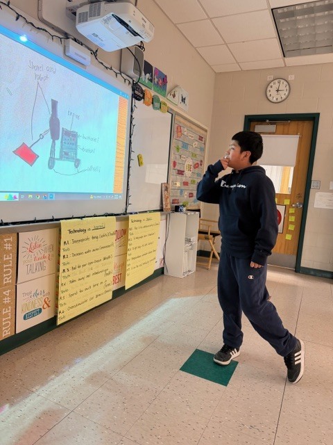 student looking at the board