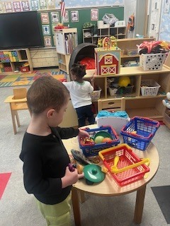 Children playing in the kitchen area.