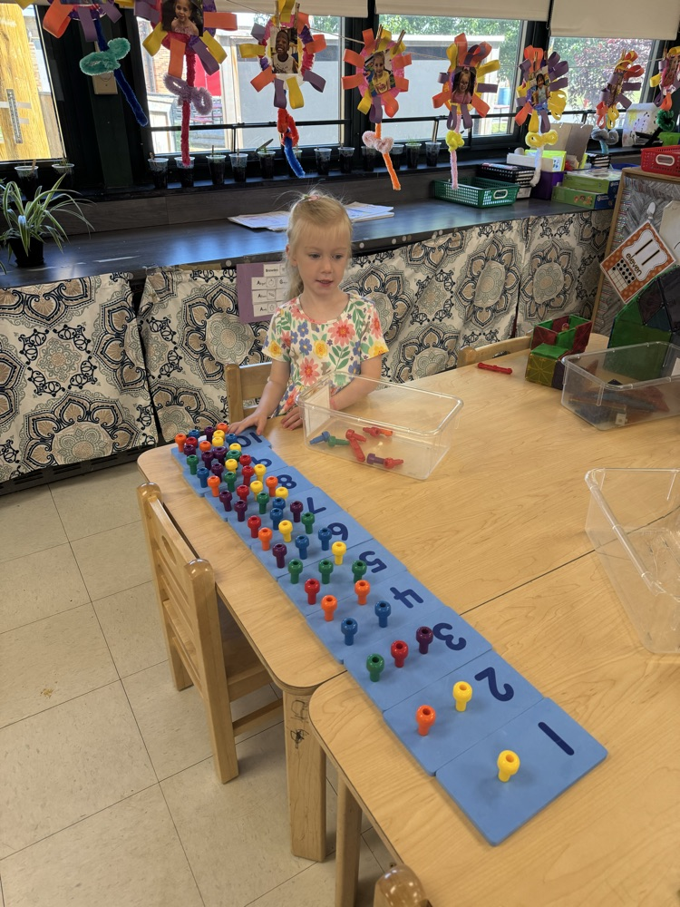 child with pegs 