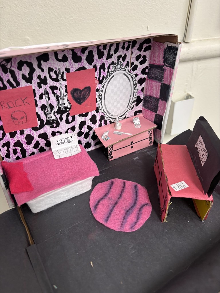cardboard box room with bedroom furniture, leopard print wallpaper and a rug