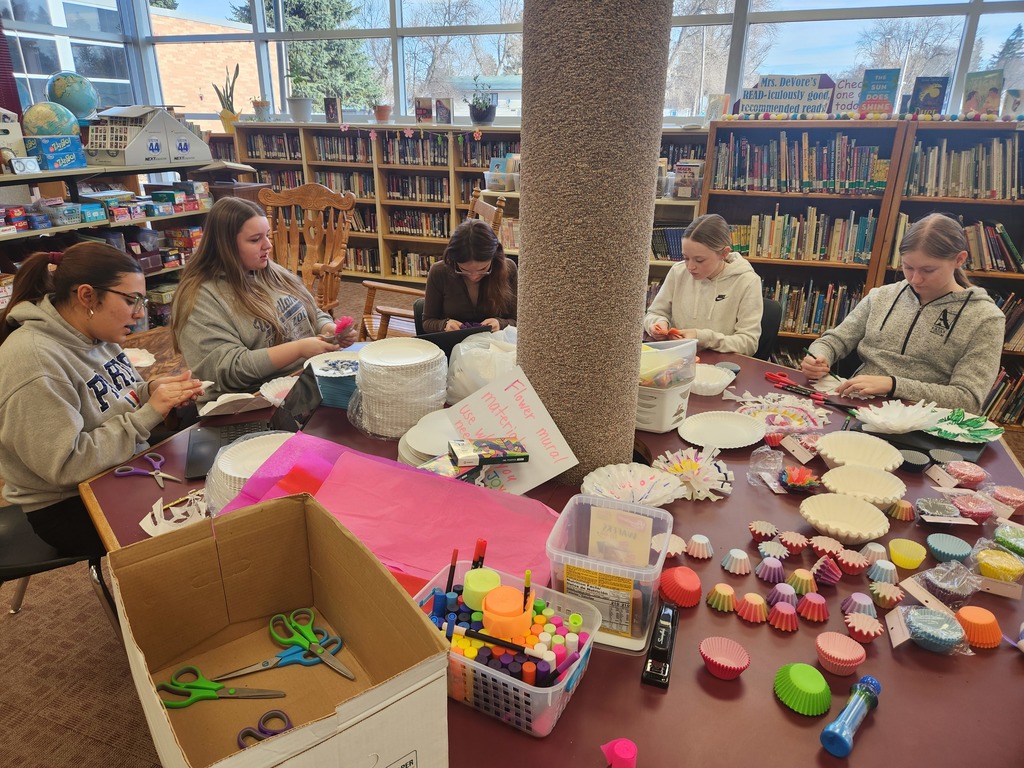 High school  artists planning and painting