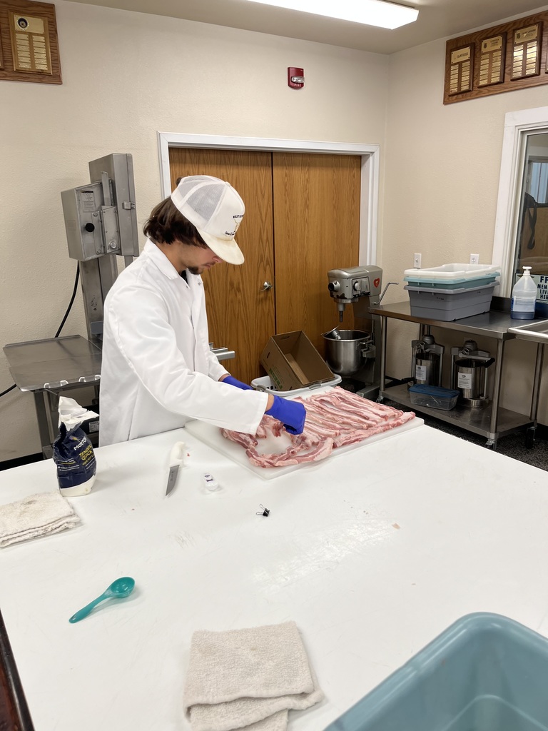 Donaven prepping bacon for packaging