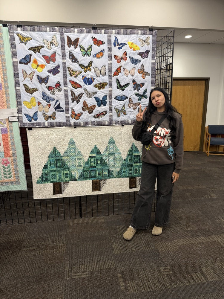 student with sewing project 