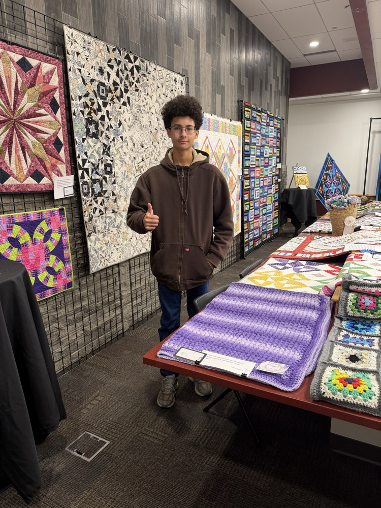 student with sewing project 