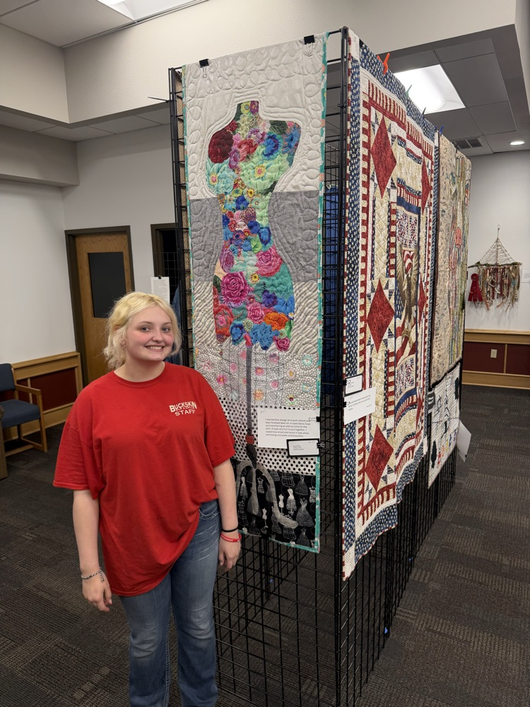 student with sewing project 