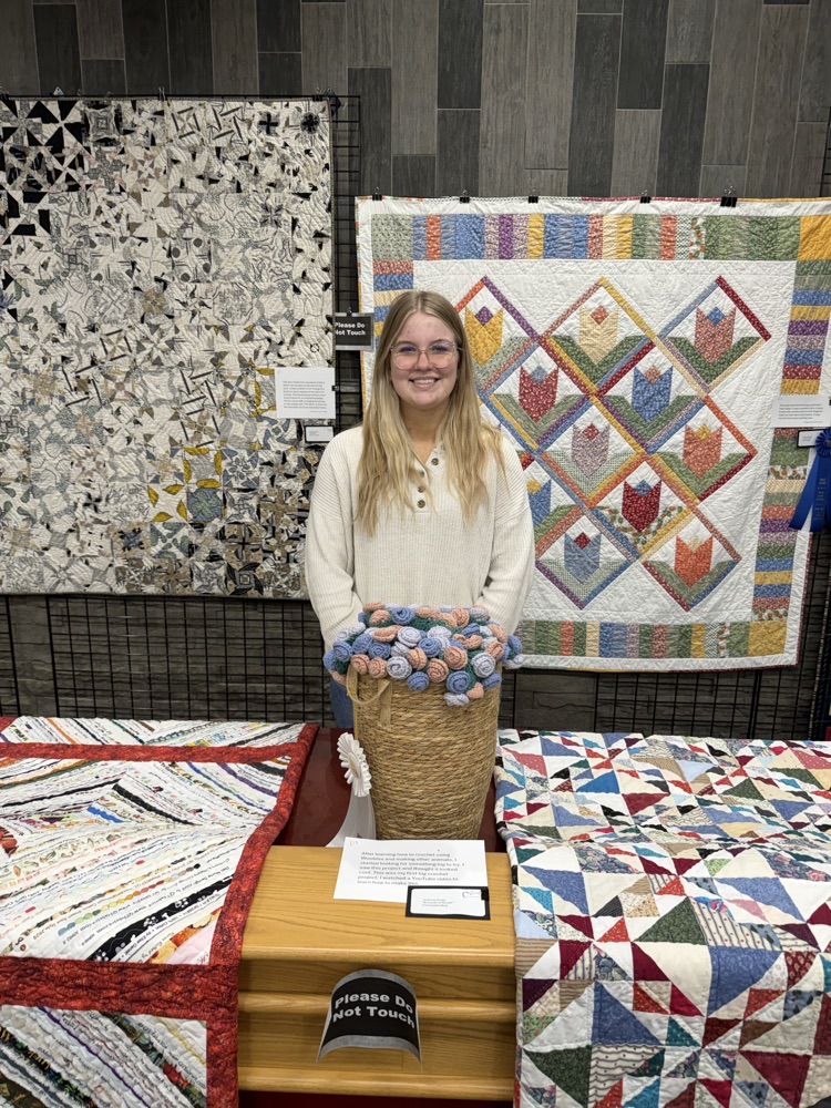 student with sewing project 