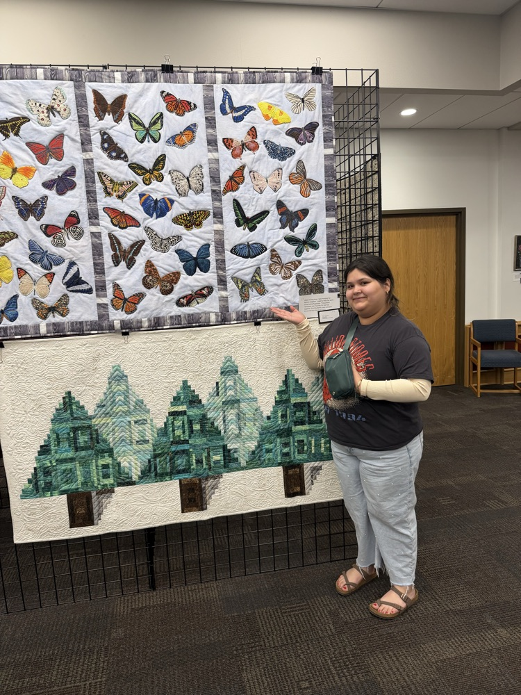 student with sewing project 