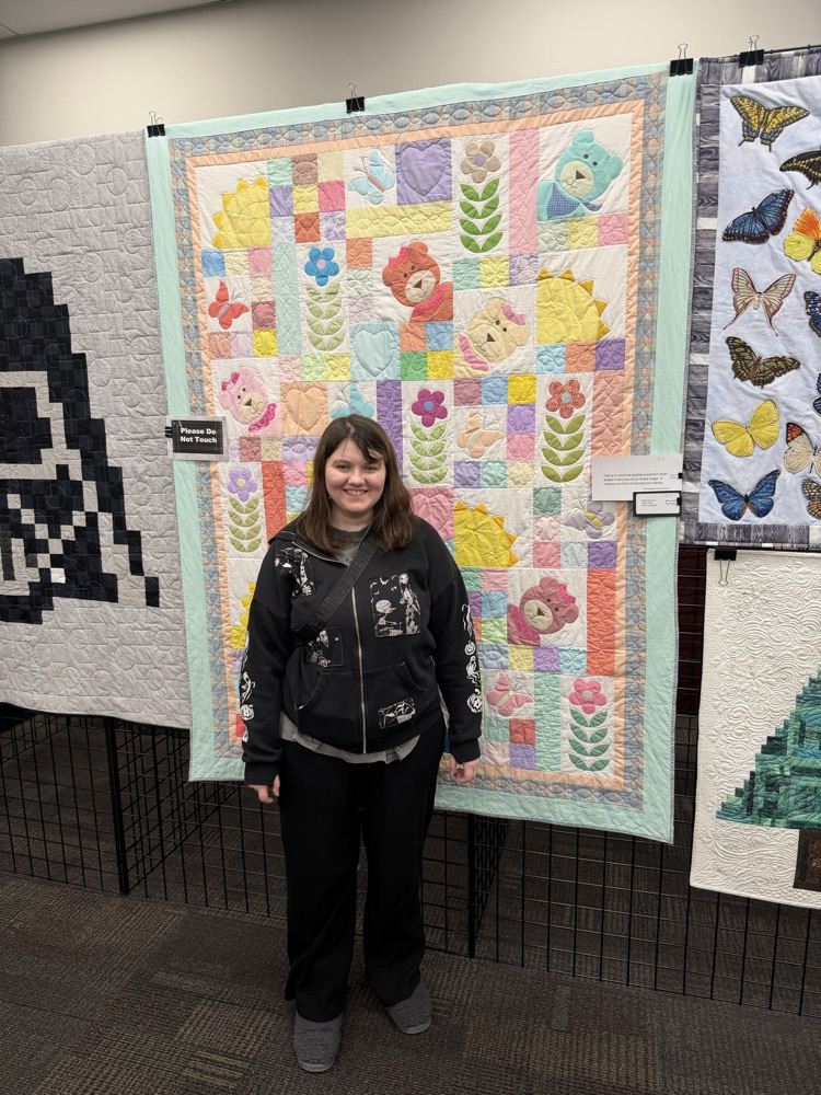 student with sewing project 