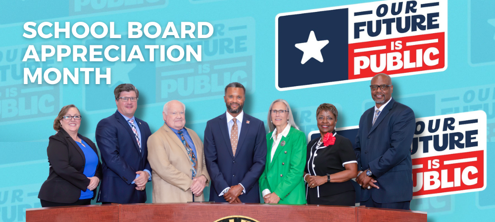 group photo of board of trustees with title school board appreciation month