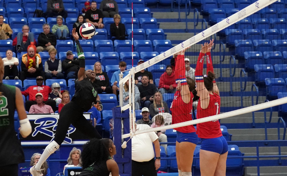 Ellison kill at the net in volleyball playoff