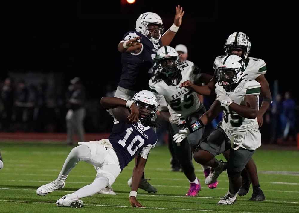 SHS QB goes into a slide