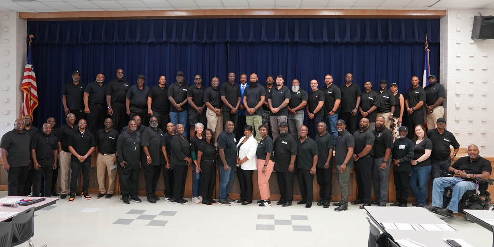 group photo of people dressed in black tshirt