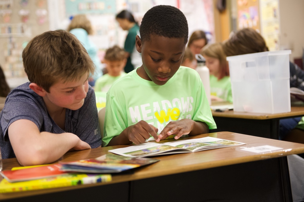 students reading a book