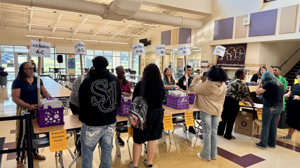 Tan background with picture of staff and students