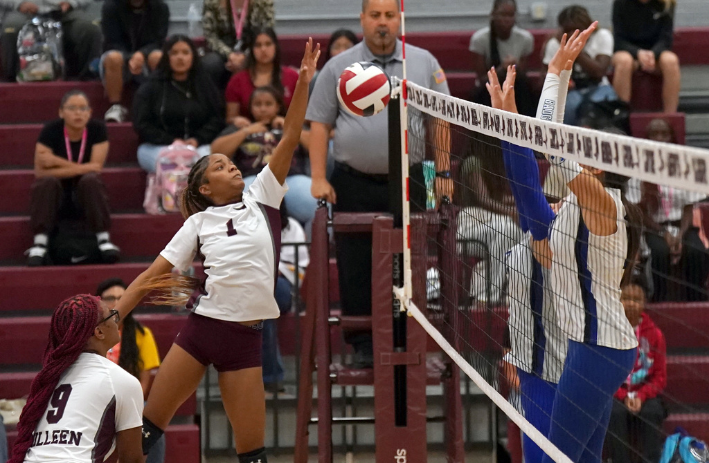 KHS volleyball hits over the net