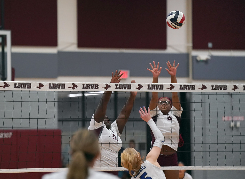 KHS volleyball block at the net