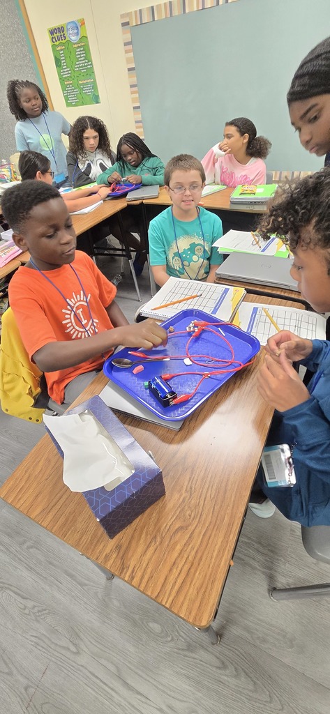 students testing electricity