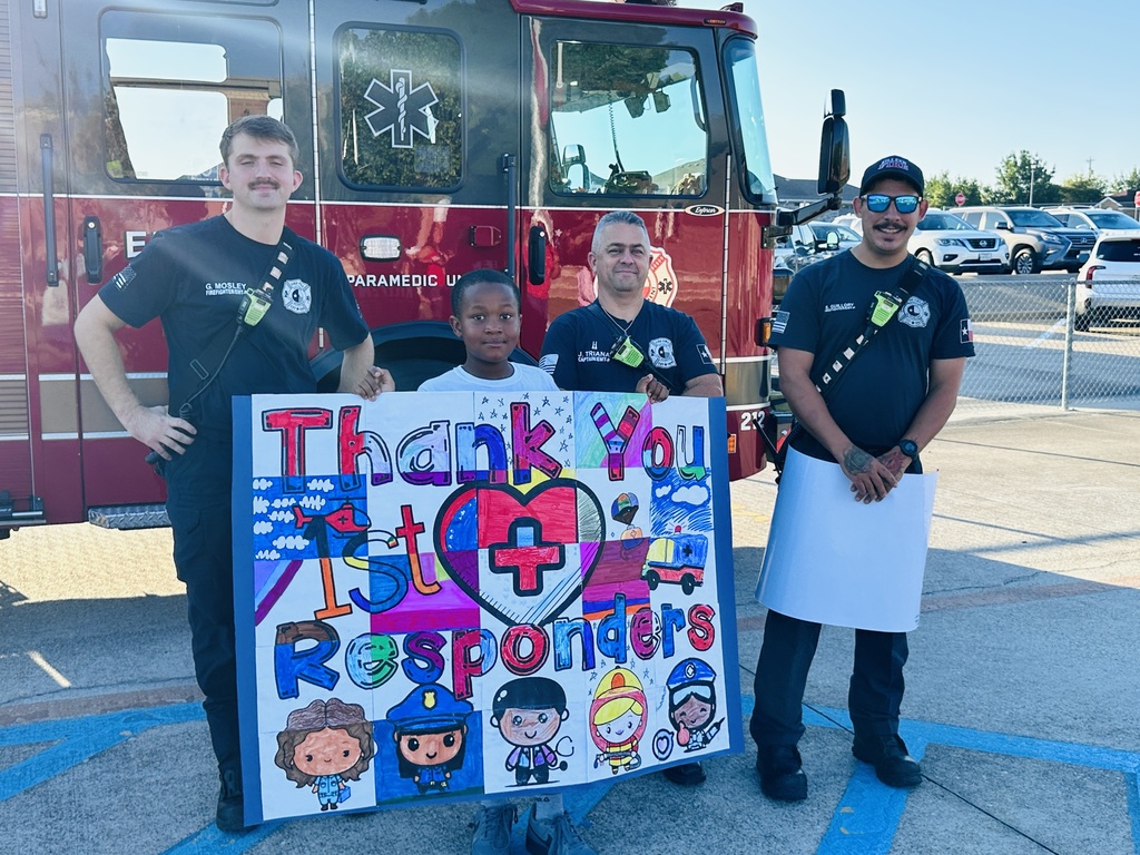 kids holding a banner with firefighters