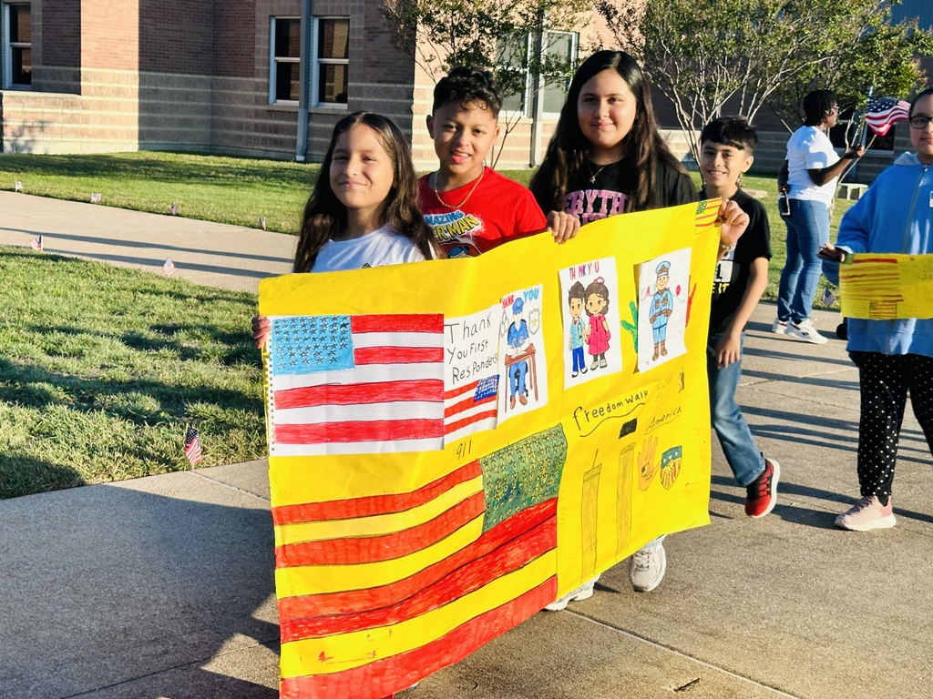  students holding a banner