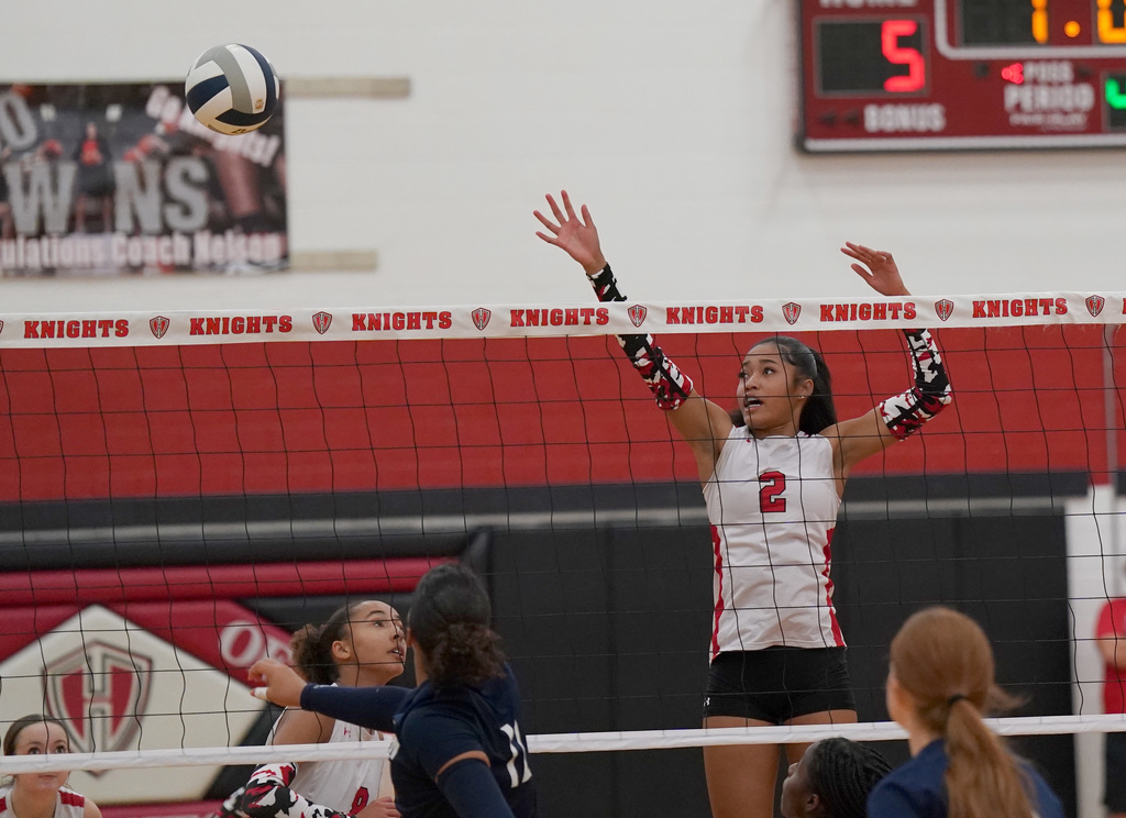 HHHS volleyball at the net