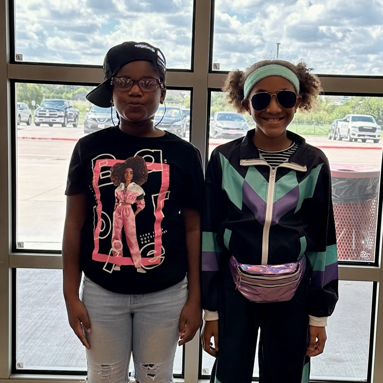 two student students dressed in hip hop era 