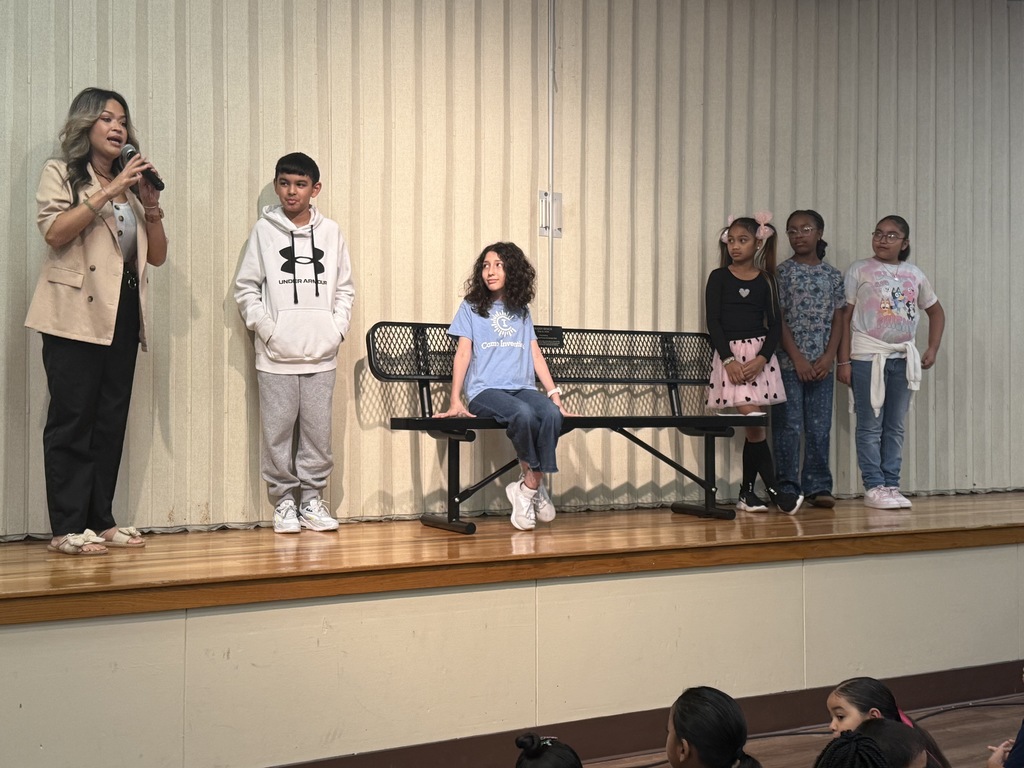 Students standing with a bench