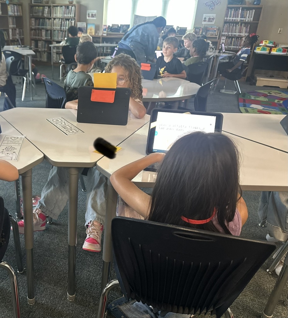 teacher helping students typing