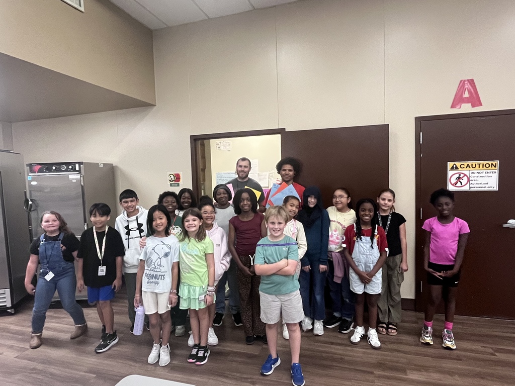 Kids giving cards to custodians