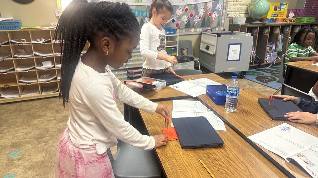 student with magnet and objects