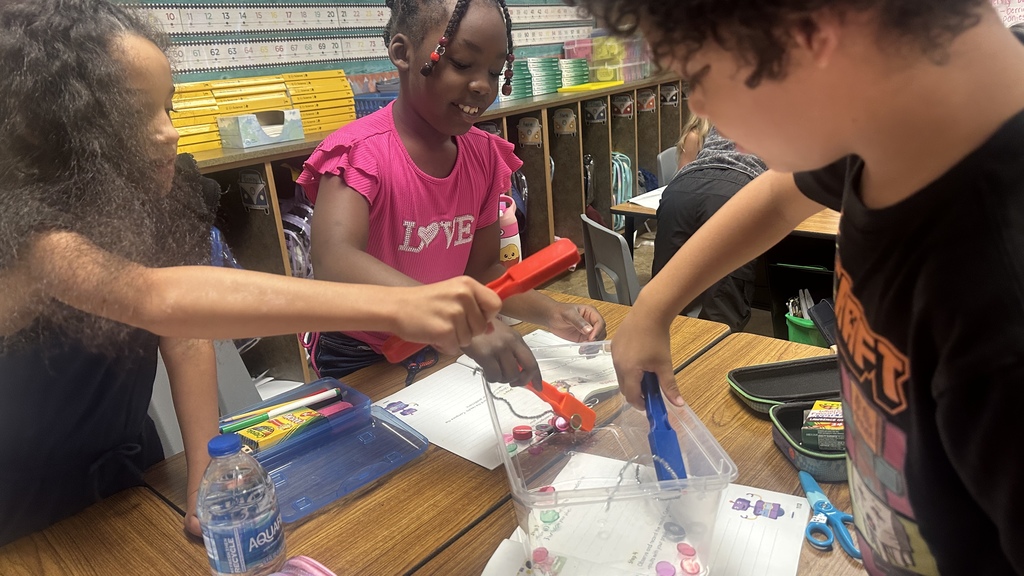students with magnets and objects