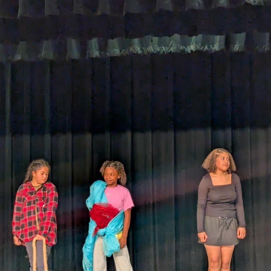 Three drama students perform