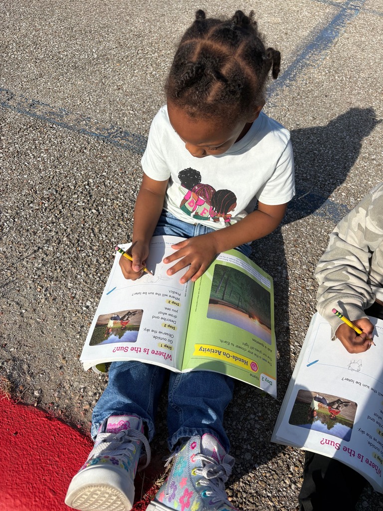students outside observing sun