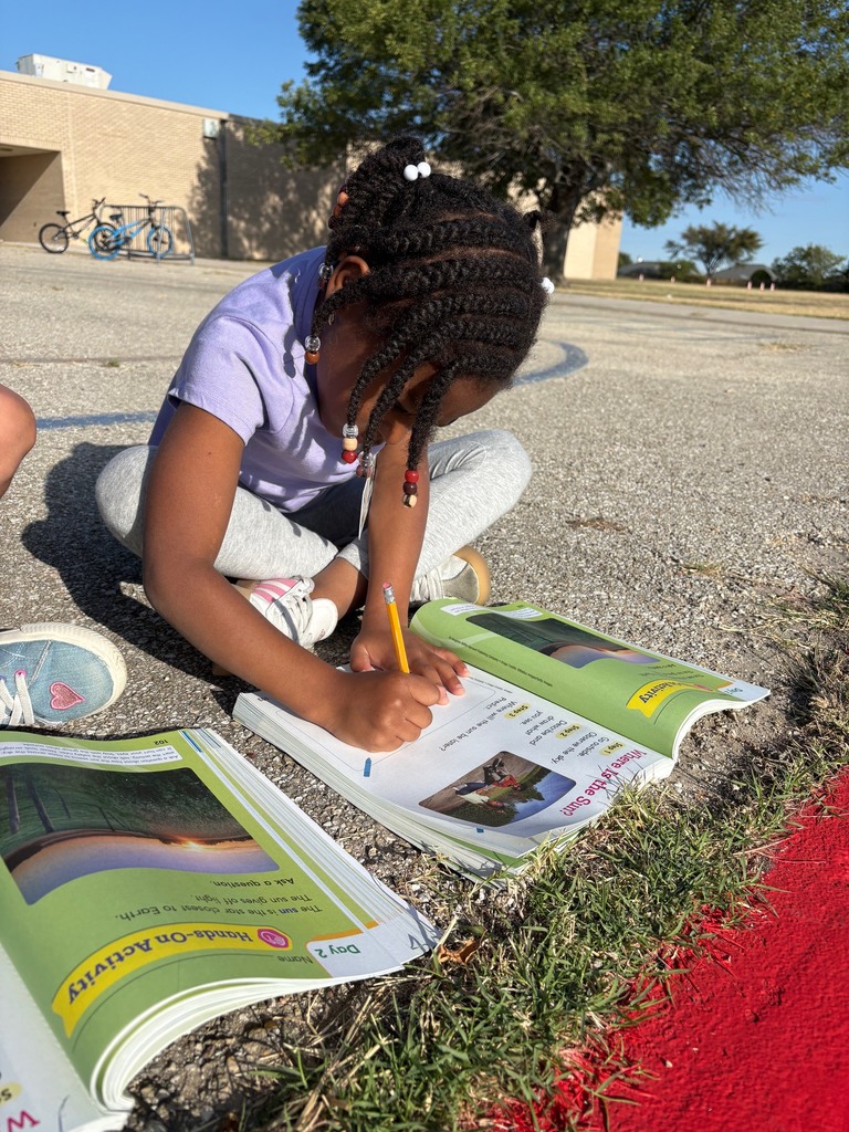 students outside observing sun