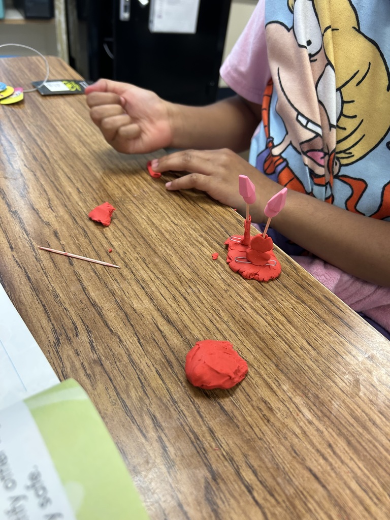 students using clay to create new objects