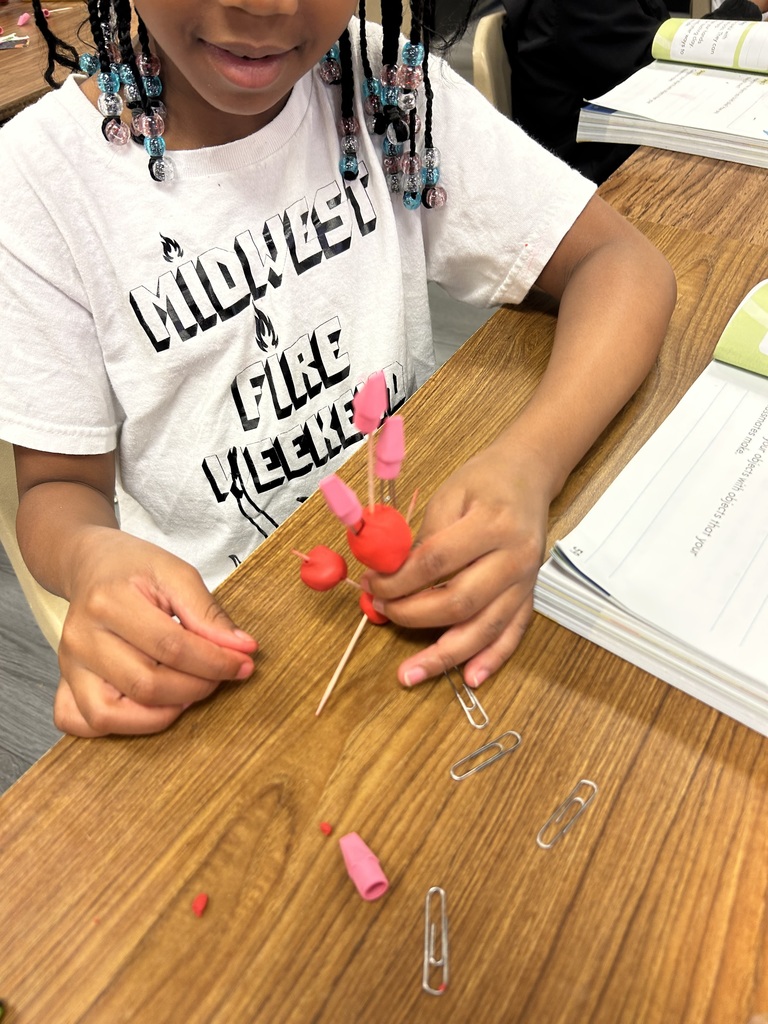 students using clay to create new objects