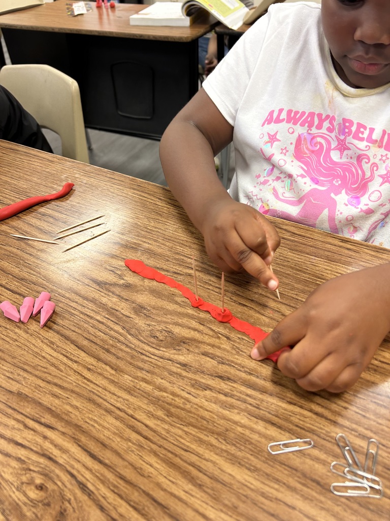 students using clay to create new objects