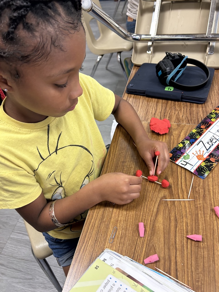 students using clay to create new objects