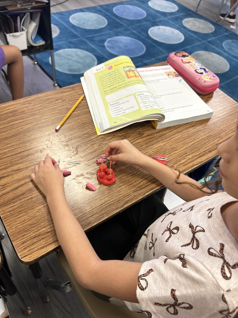 students using clay to create new objects