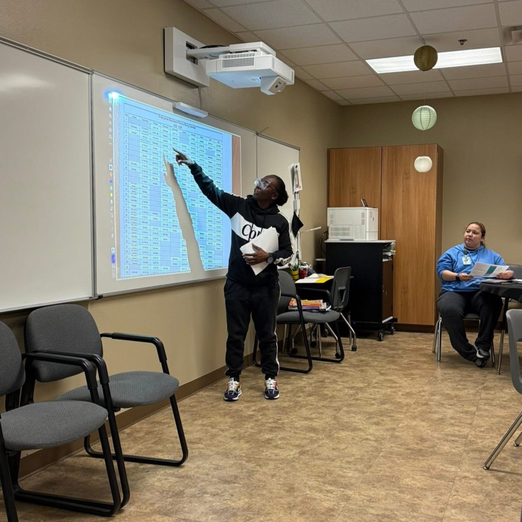 teacher working on whiteboard 