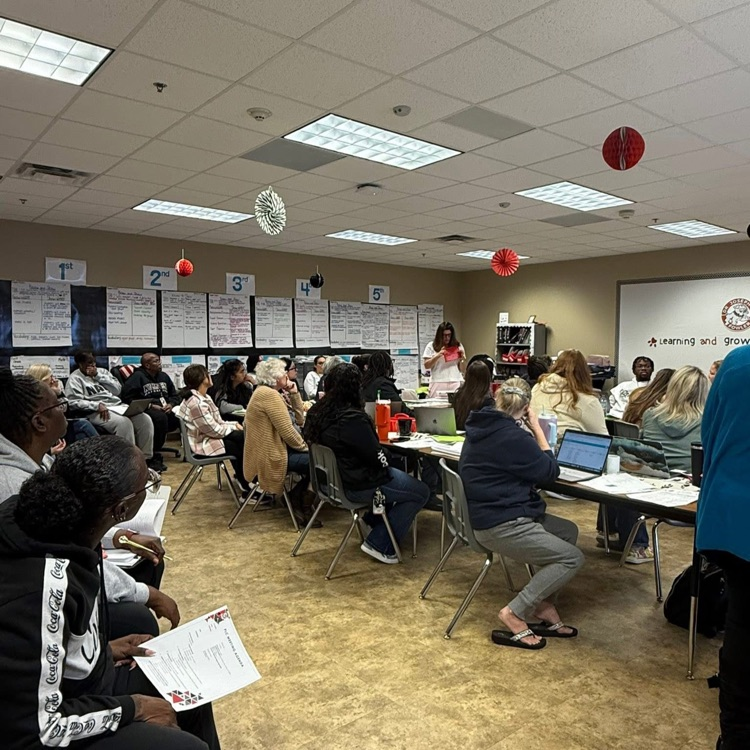 Staff in classroom working