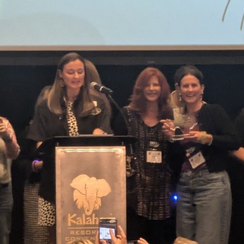 Teacher Kim Squires and Kendall Crossley accepting KISD's award