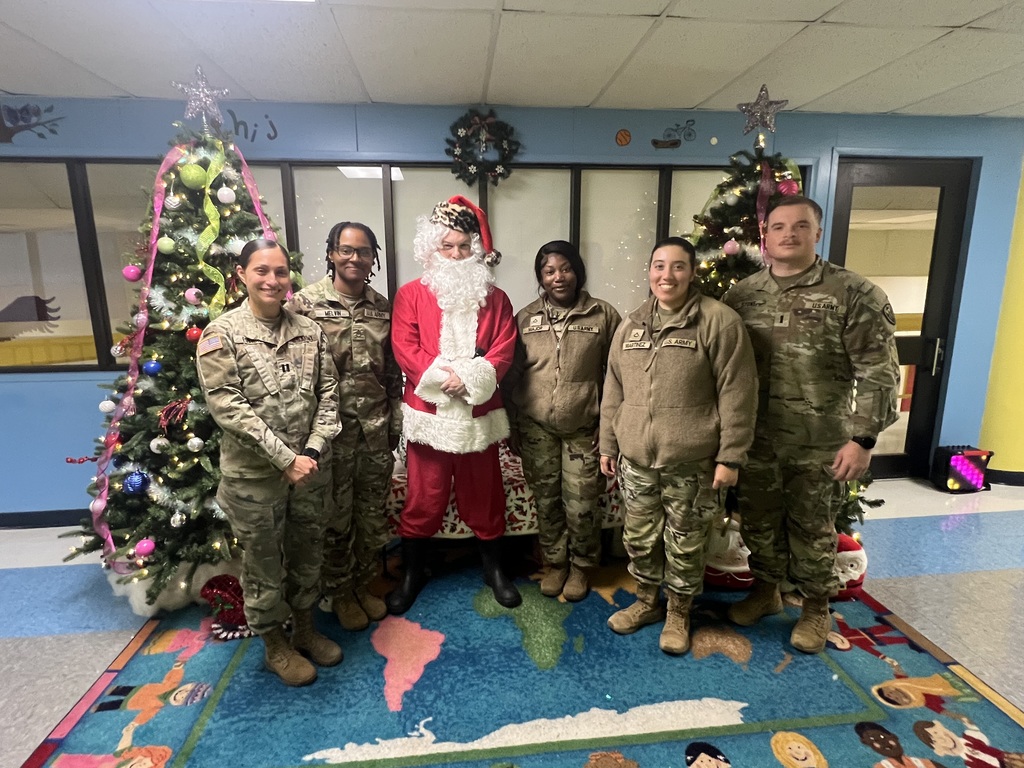 Santa and posing with the soldiers.