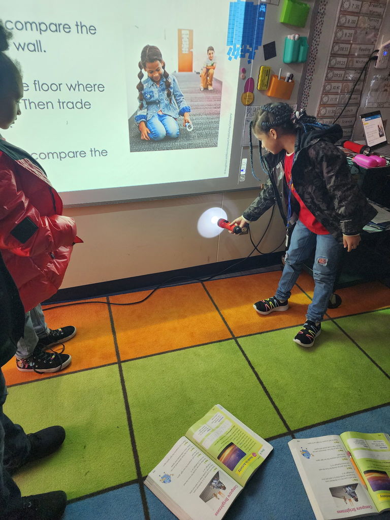 students with flashlights