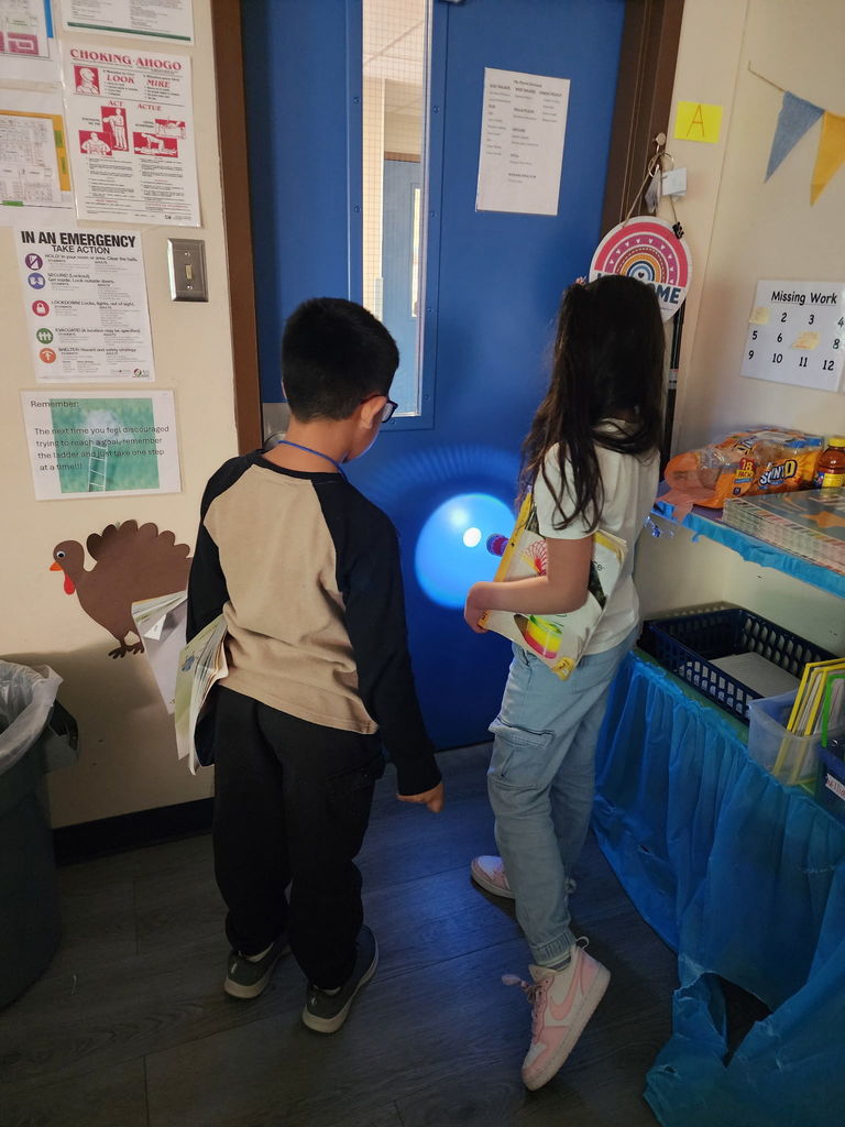 students with flashlights